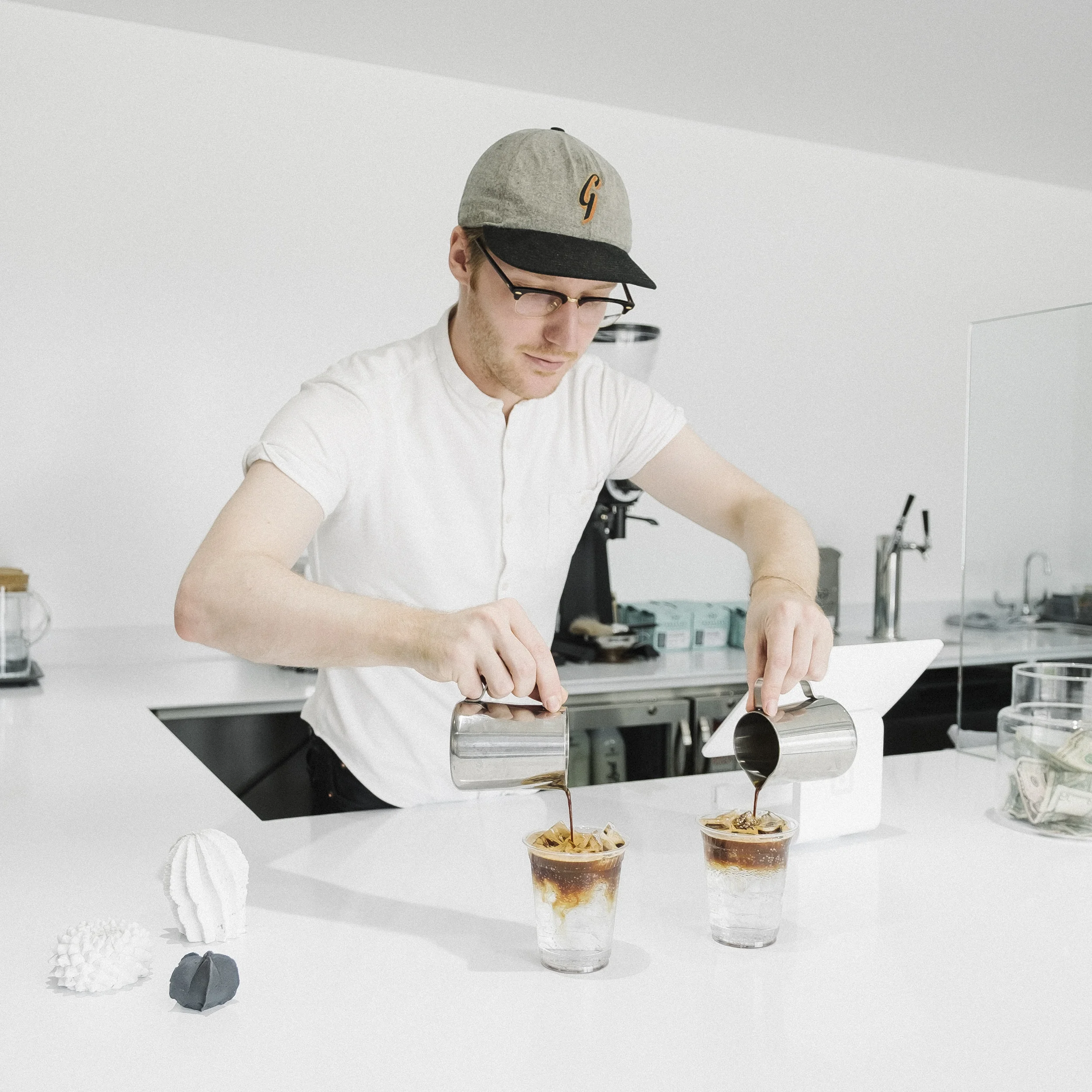 Barista, Shelby Moore rocking out a drink that brew my mind. Bryan said he was going to order an espresso and tonic. So I said, cool, I'll get that as well. I was expecting a double shot with a side of tonic water. DUDE! I was so wrong. This is by far one of the most refreshing coffee based drinks I've had in a long time and I cannot wait to have it again. My espresso machine gets back from the repair shop this Thursday and you know I'll be rocking that out immediately. 