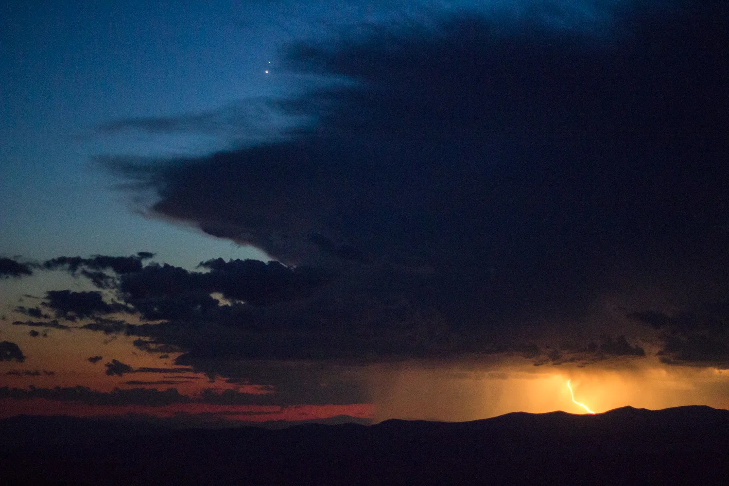 Watching a distant lightning storm atop Abercrombie Mountain after a sunset hike • Washington, USA •