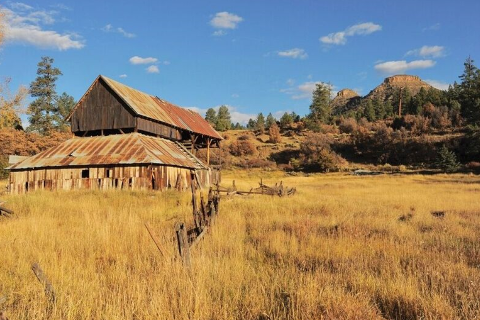 The barn from when Twin Butte was the McIntyre Ranch, with the real buttes in the background. Photo courtesy of Terri Pauls.