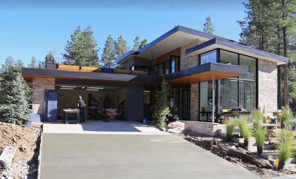 Twin Buttes - Passing a large-scale community development project in a western town