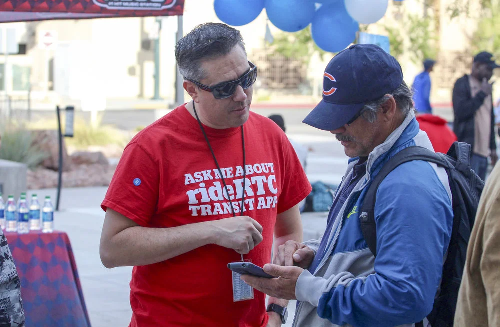STREET TEAMS COMPRISED OF RTC STAFF AND EXTERNAL PERSONNEL DIRECTLY MARKETED ITS NEW SMARTPHONE TRANSIT TICKETING AND TRIP PLANNING APP, RIDERTC, TO CUSTOMERS, ULTIMATELY INTERACTING WITH MORE THAN 4,100 CUSTOMERS AT 90-PLUS OUTREACHES HELD AT TRANSIT FACILITIES AND BUS STOPS THROUGHOUT THE VALLEY OVER A PERIOD OF THREE MONTHS. PHOTO PROVIDED BY RTC.