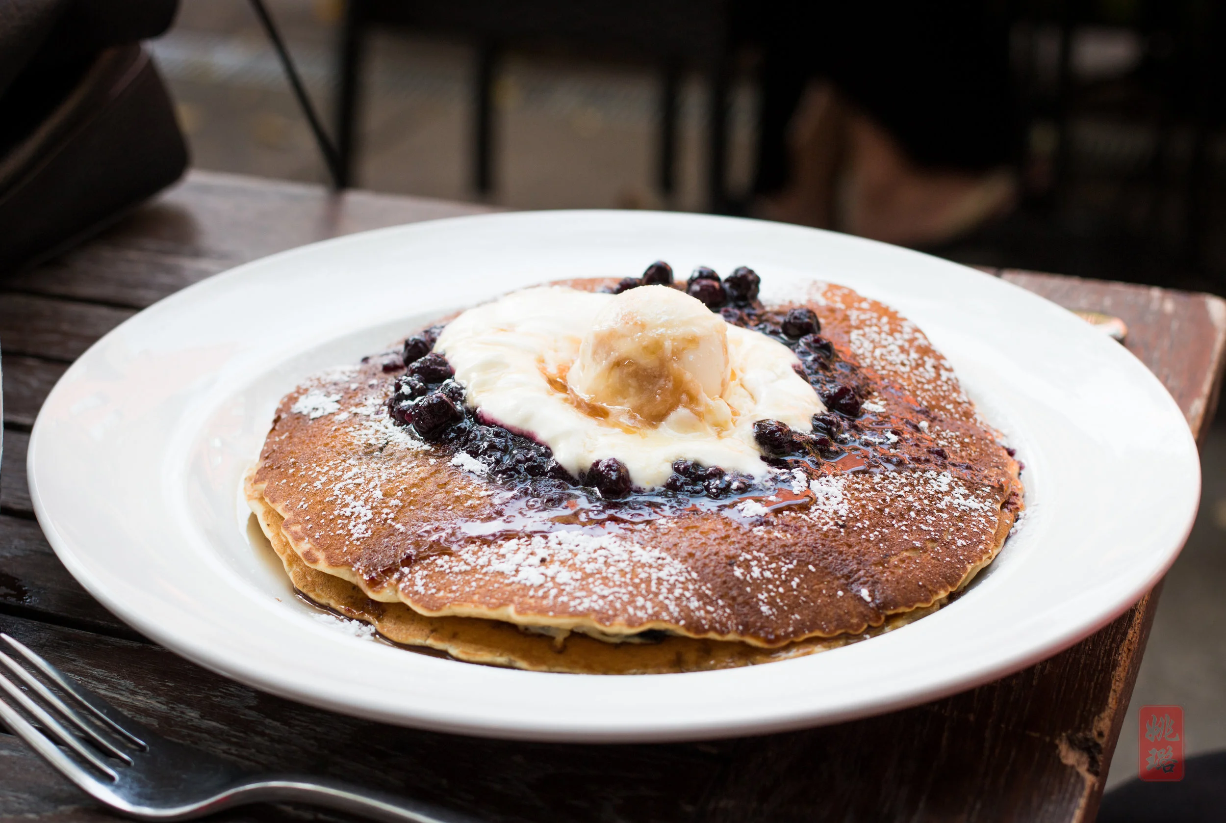 Blueberry ricotta pancakes - blueberry pancakes topped with blueberry compote, sweet lemon whipped cream and caramel butter