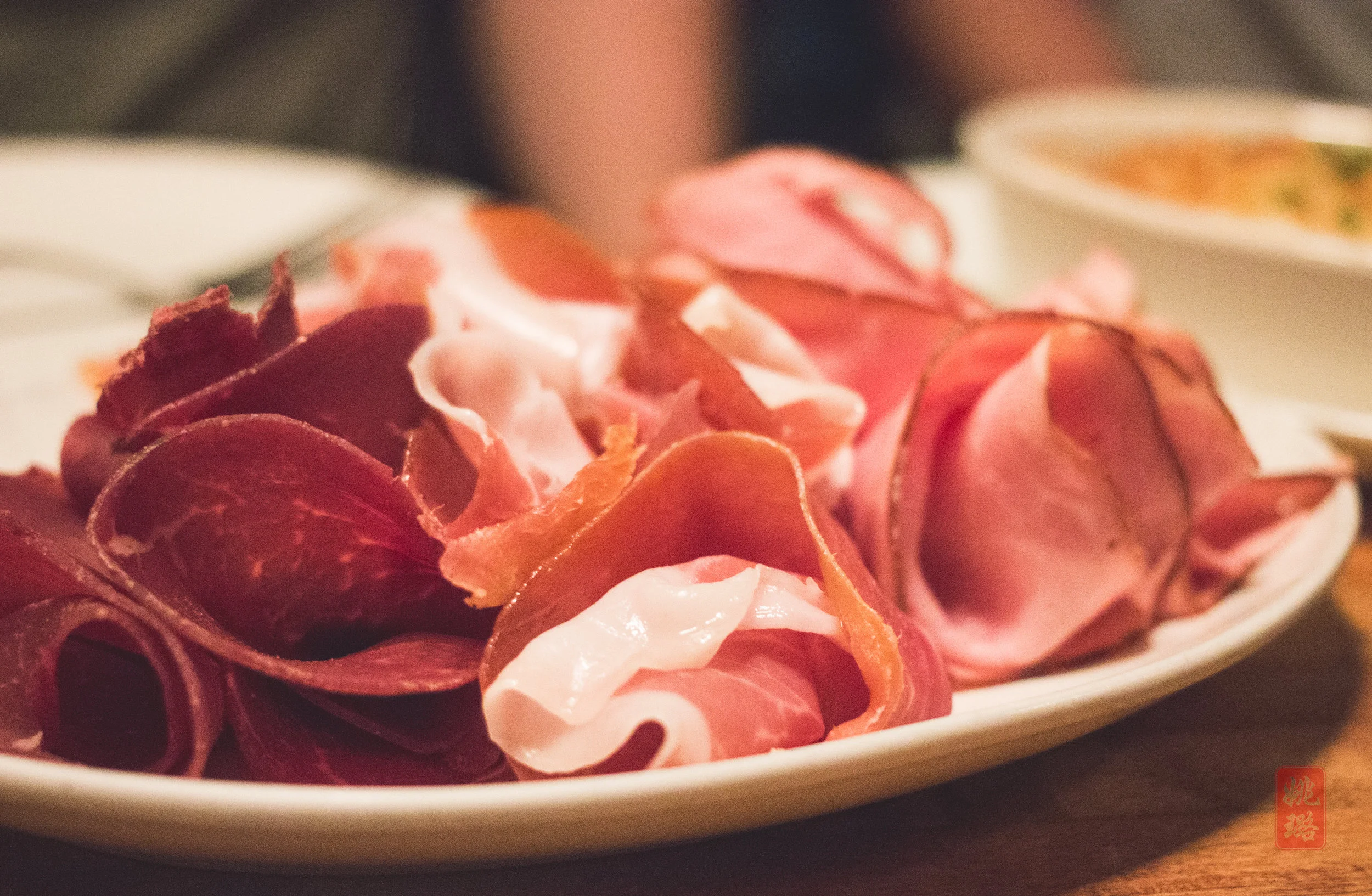 The meats in the Complete Suisse platter: Viande séchée, prosciutto de Parma, jambon de Paris, Saucisson sec