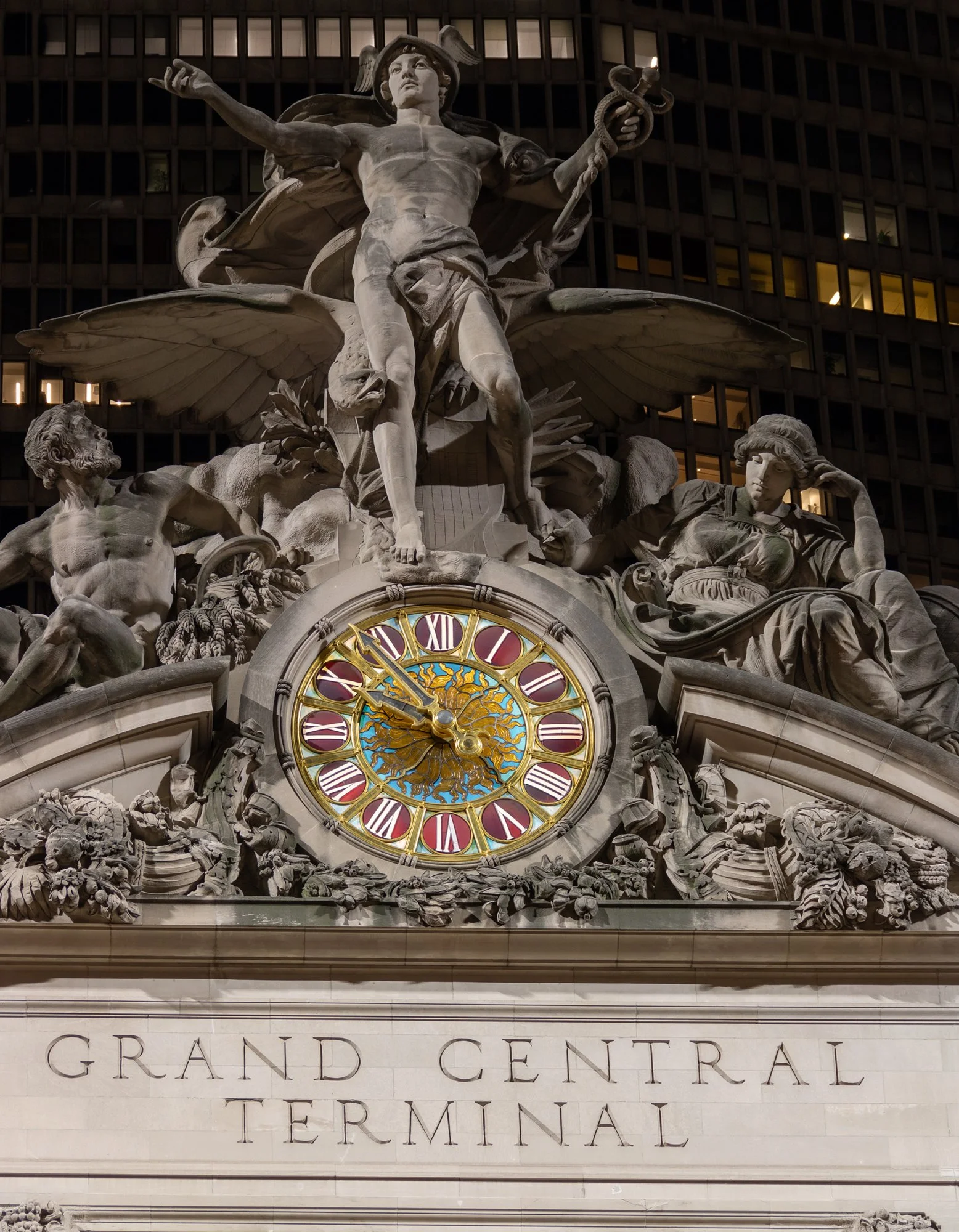 Glory of Commerce Sculpture Group at Night - New York City