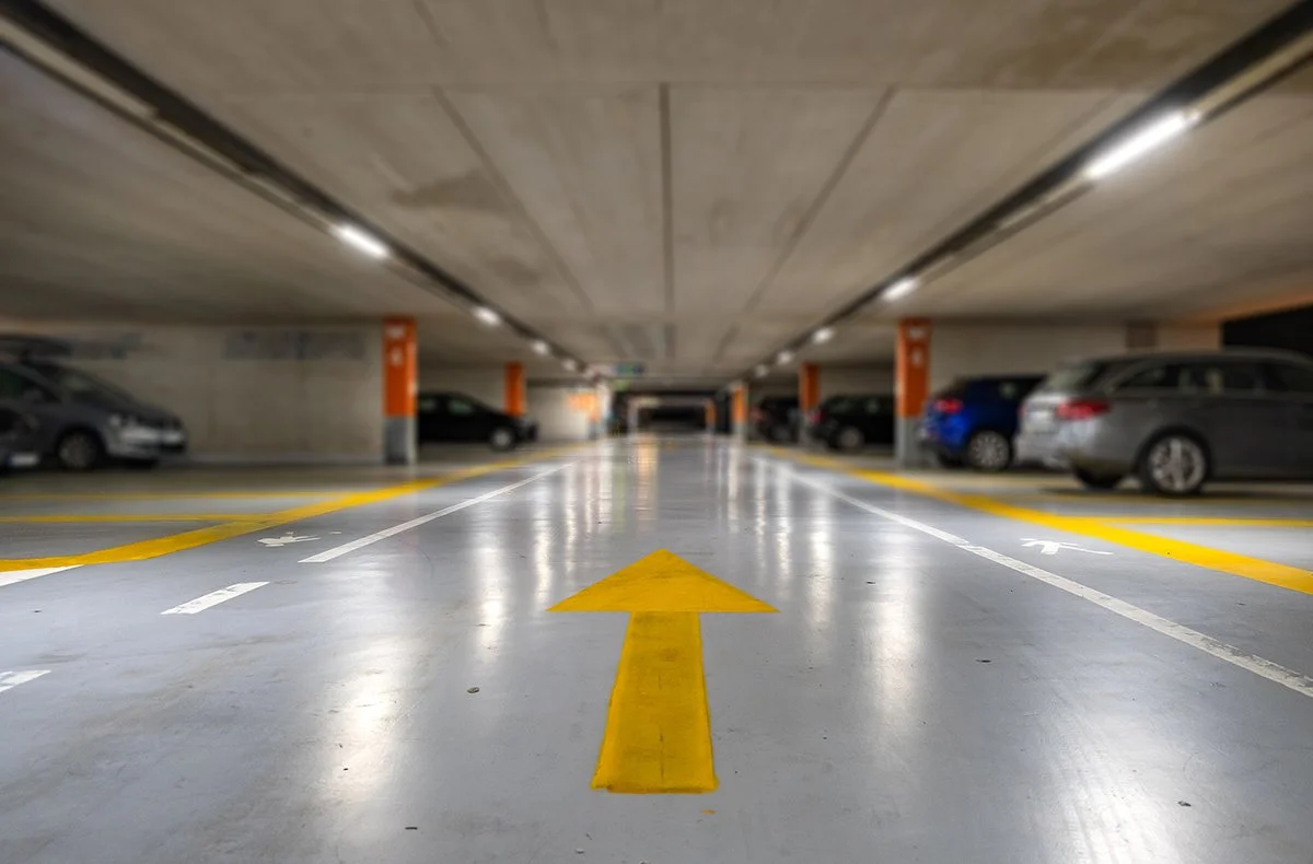 yellow-markings-with-blurred-modern-cars-parked-in-2026-01-06-09-54-15-utc.jpg