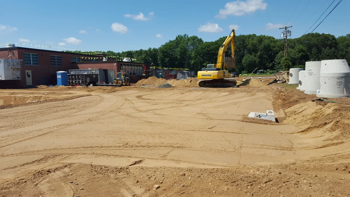 New bus loop drop-off and staff parking area.