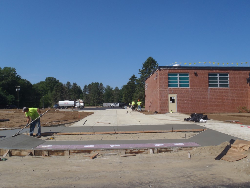 Plaza connecting bus drop-off to student drop-off and main entrance.