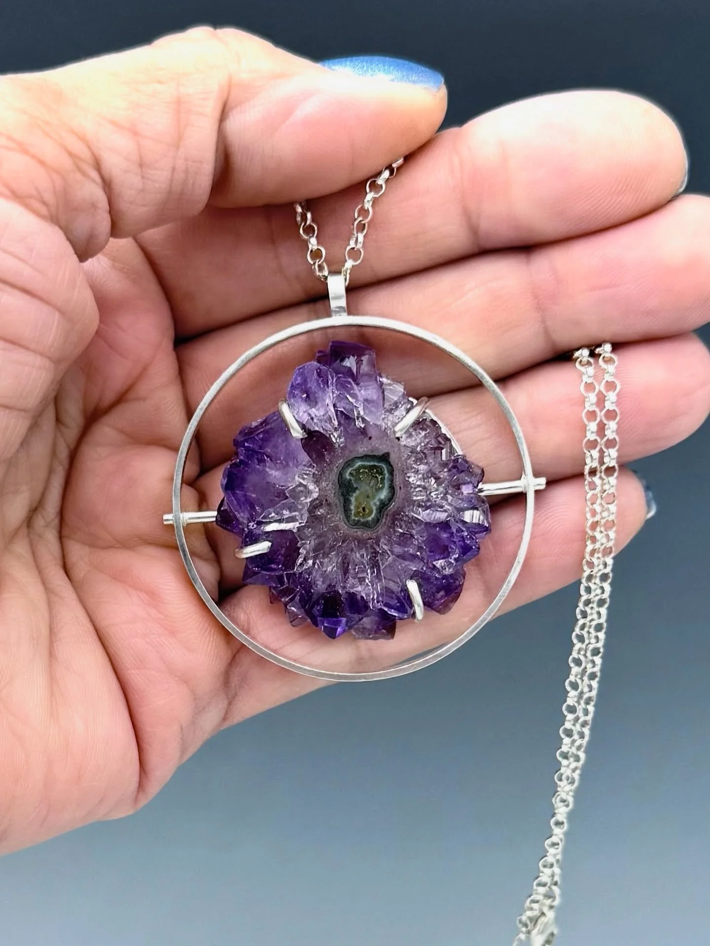 One-of-a-kind Circle Necklace with a slice of Amethyst Stalactite. 

I will be at the 43rd Redding Artisan Church Fair on Saturday and at Waveny Park Art Festival in New Canaan on Sunday. Come and try this gorgeous necklace!