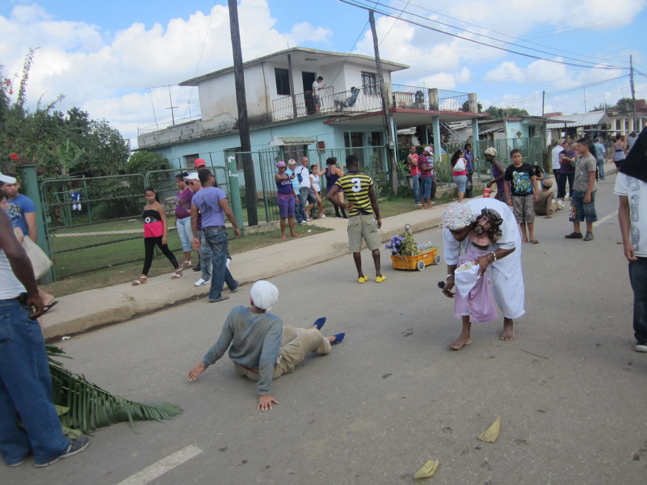 We had the opportunity to take part in San Lazaro's (Babaluaye in Santeria) day and join thousands of people in the long walk to his church. Many who had asked the saint for something that year showed their dedication to him by dragging heavy loads on their knees all the way to the church. Twins or Jimaquas are sacred to him and we passed these little girls on the way.