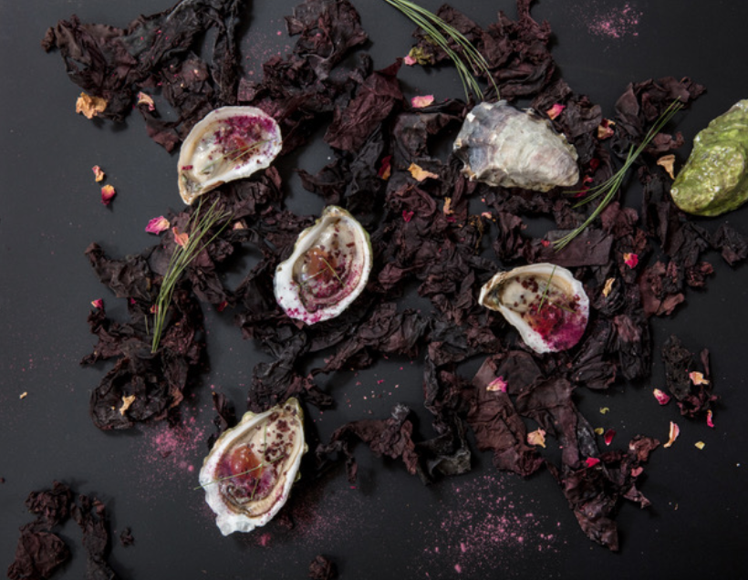 Tessa Liebman_Oysters with Dulse and Rosepetals, after MAINE by MCMC Fragrances_photographer Caroll Taveras_2018_this was a collaboration with photographer Caroll Taveras. I art directed and styled the photo which is an abstract plating of a dish that was created for a dinner with the perfumer Anne McClain of MCMC Fragrances and is based on her scent MAINE. Tessa Liebman_2018_Photo is by Caroll Taveras and art directed/styled by Tessa Liebman_the photo is a fantasy plating scheme for a dish based on a fragrance created by Anne McClain of MCMC Perfumes called MAINE. The fragrance was inspired by falling in love with her (now) husband on a beach in Maine and contains notes of beach rose, pine, briny air and beach plum which I mimicked with ingredients such as umeboshi, dulse and other sea plants, pine essential oil and rose petals.