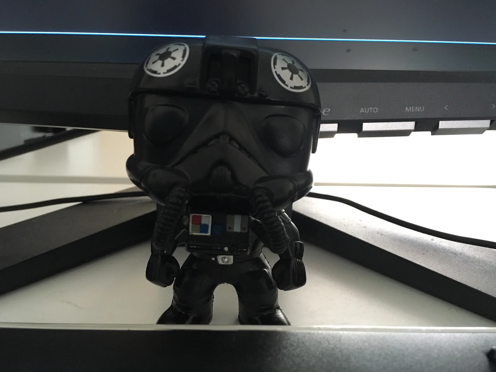 Imperial TIE pilot Funko Pop. His name is Vents because his breathing tube was broken and had to be repaired. I love you all the more for coming to me a little busted up, Vents. 