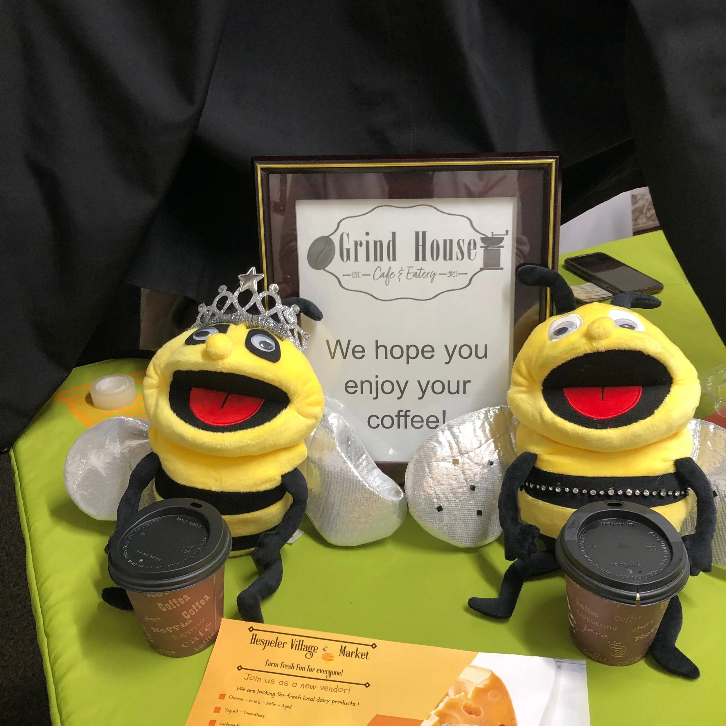 Shelbee and Bixbee drop by the toy drive today to enjoy a delicious Grind House coffee and pick up their Grind House coupons. Shelbee lost one of her fake eyelashes in the wind. Stay tuned for more exiting adventures as our new HVM mascotts premier t