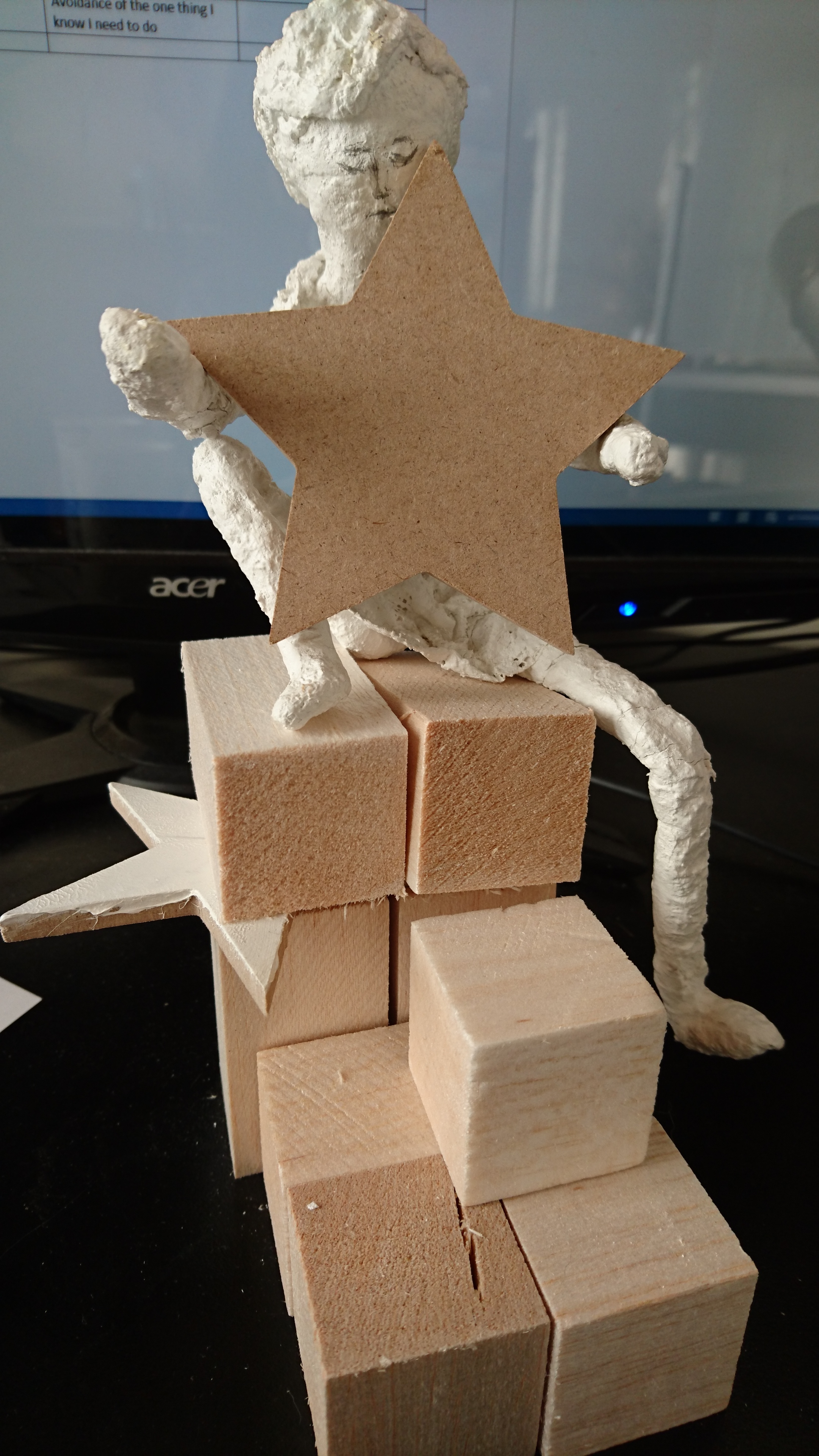 she sits on my desk. sometimes upright. sometimes toppled. starring hope. tumbling like a night sky. only to rise against the blocks she fears inside.