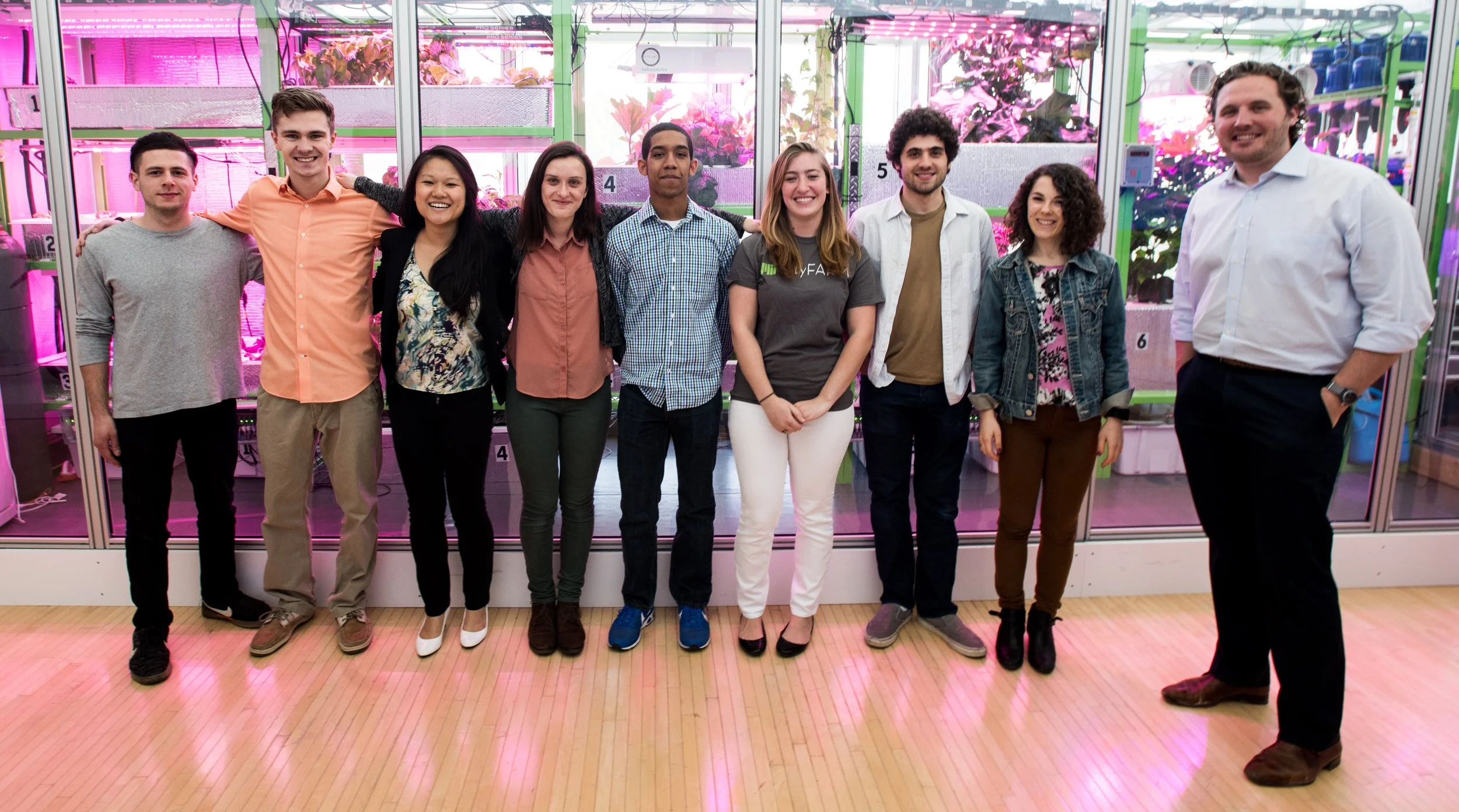 The CityFARM team poses in front of the farm.
