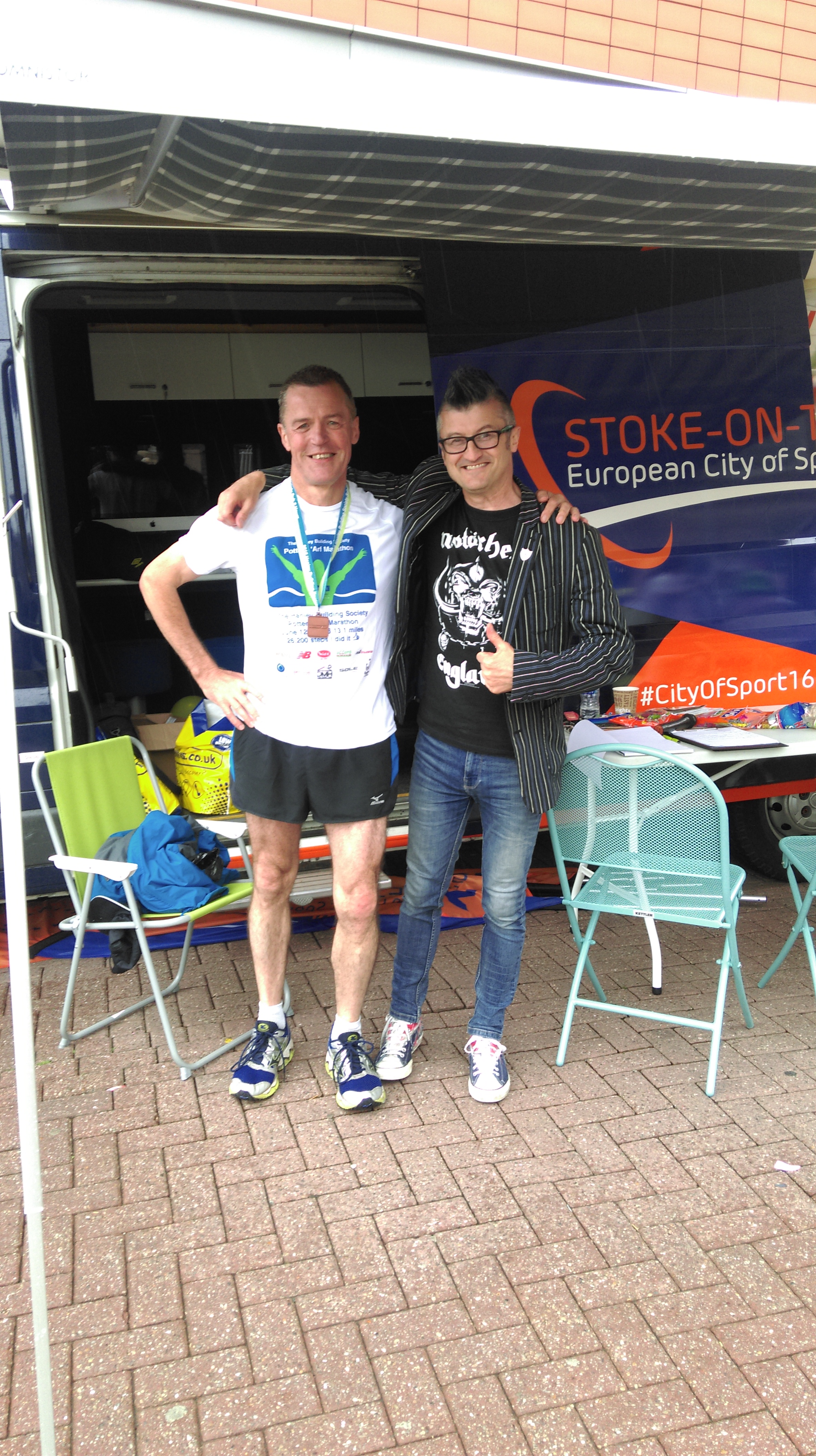 Being held upright by Spoz - not sure my legs were working at this stage. But I've got my medal!