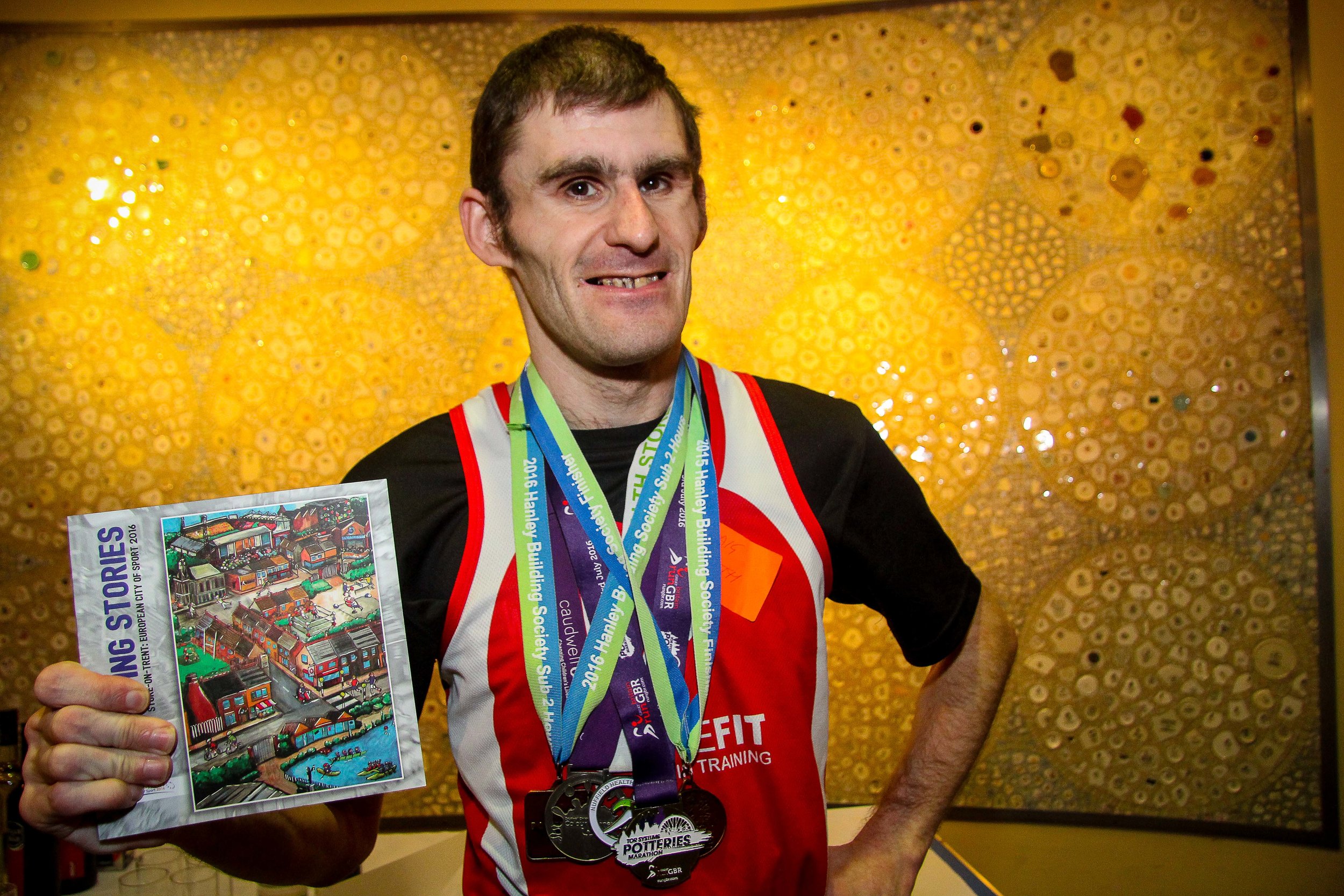 Craig, StokeFIT runner, Vale supporter and author, with a great Potteries medal collection!