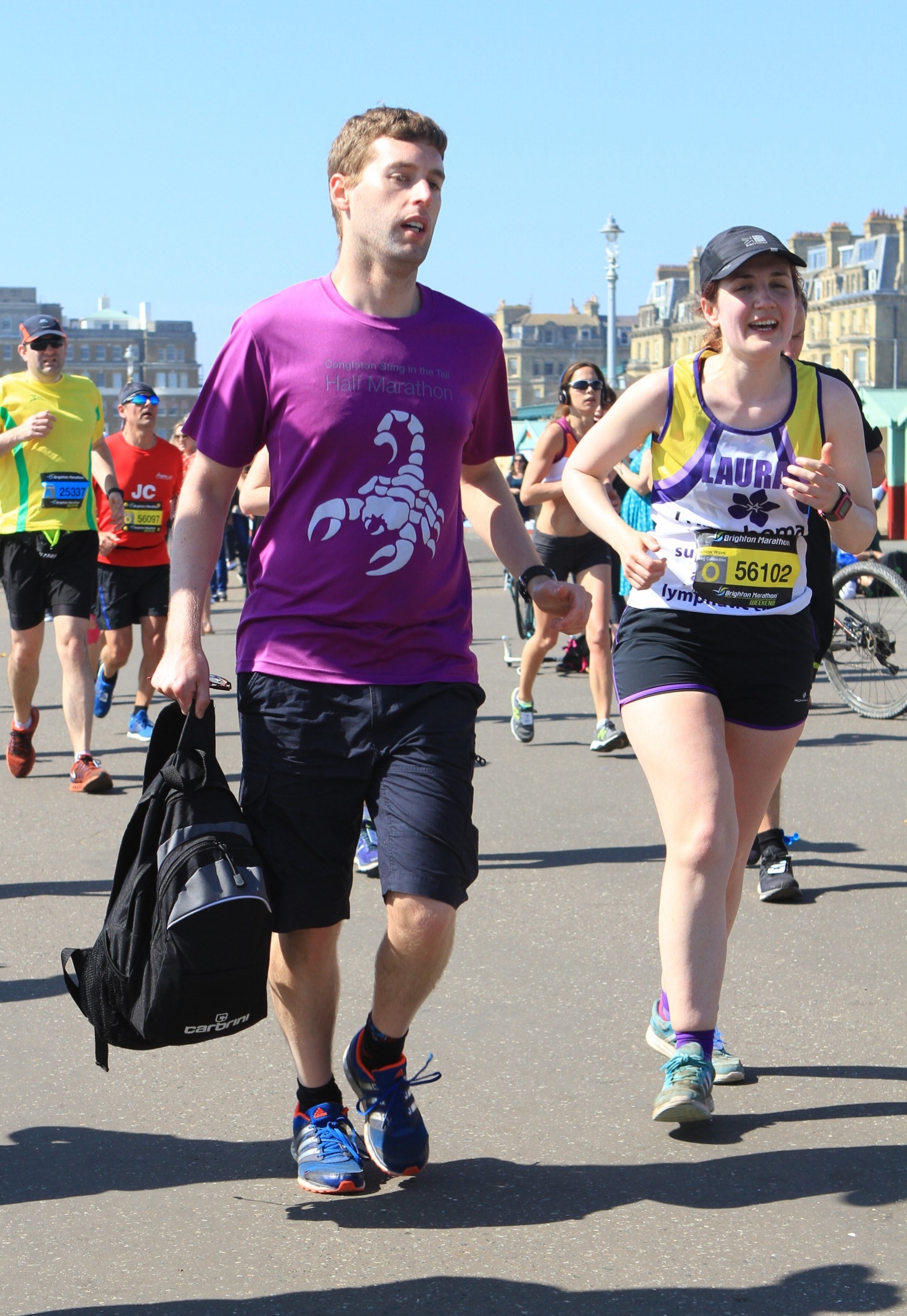 Craig running with Laura at the finish. Photo courtesy Marathon-Photos.com