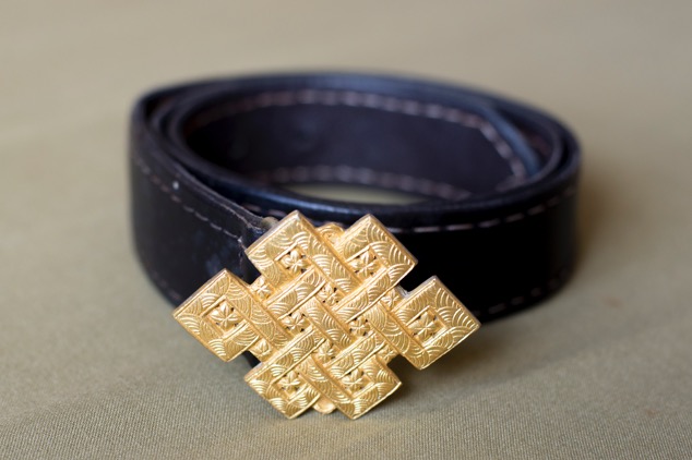 Plain buddhist eternal brass knot. Variable sizes.