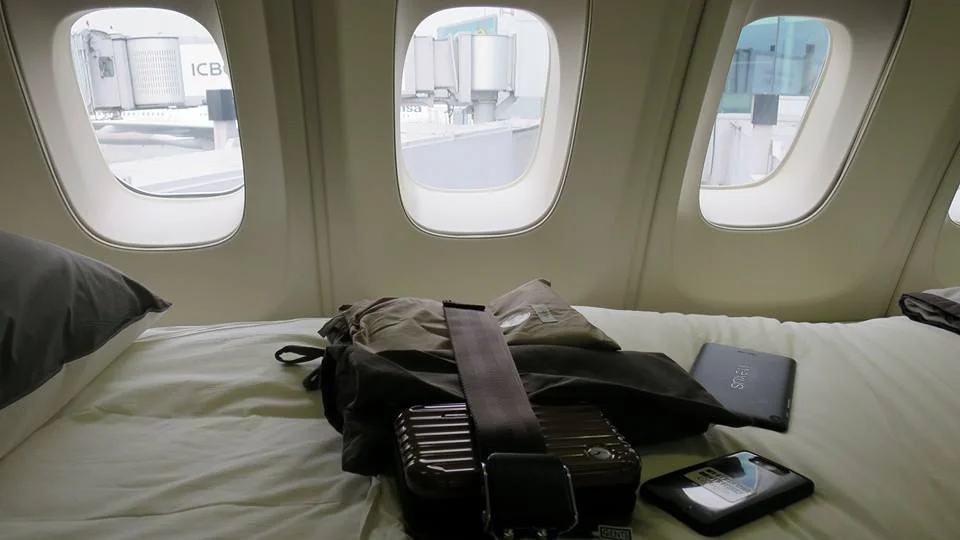 Also included are pretty standard for a first class product: A set of pajamas, slippers, and an amenity kit. LH has a Rimowa amenity set
