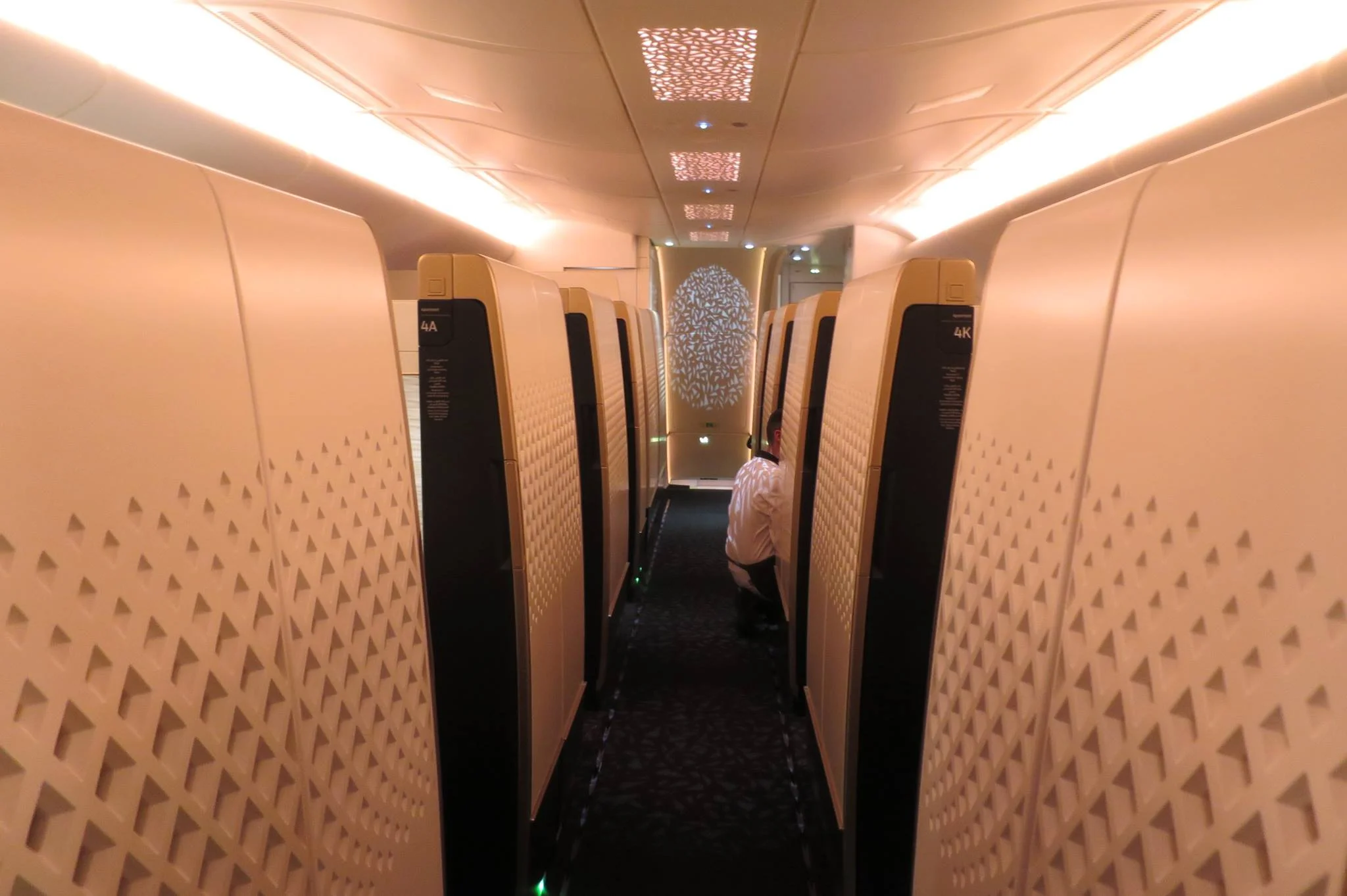 One central aisle in the first class section. Apartments to either side. The Residence to the left in the front. Shower to the right