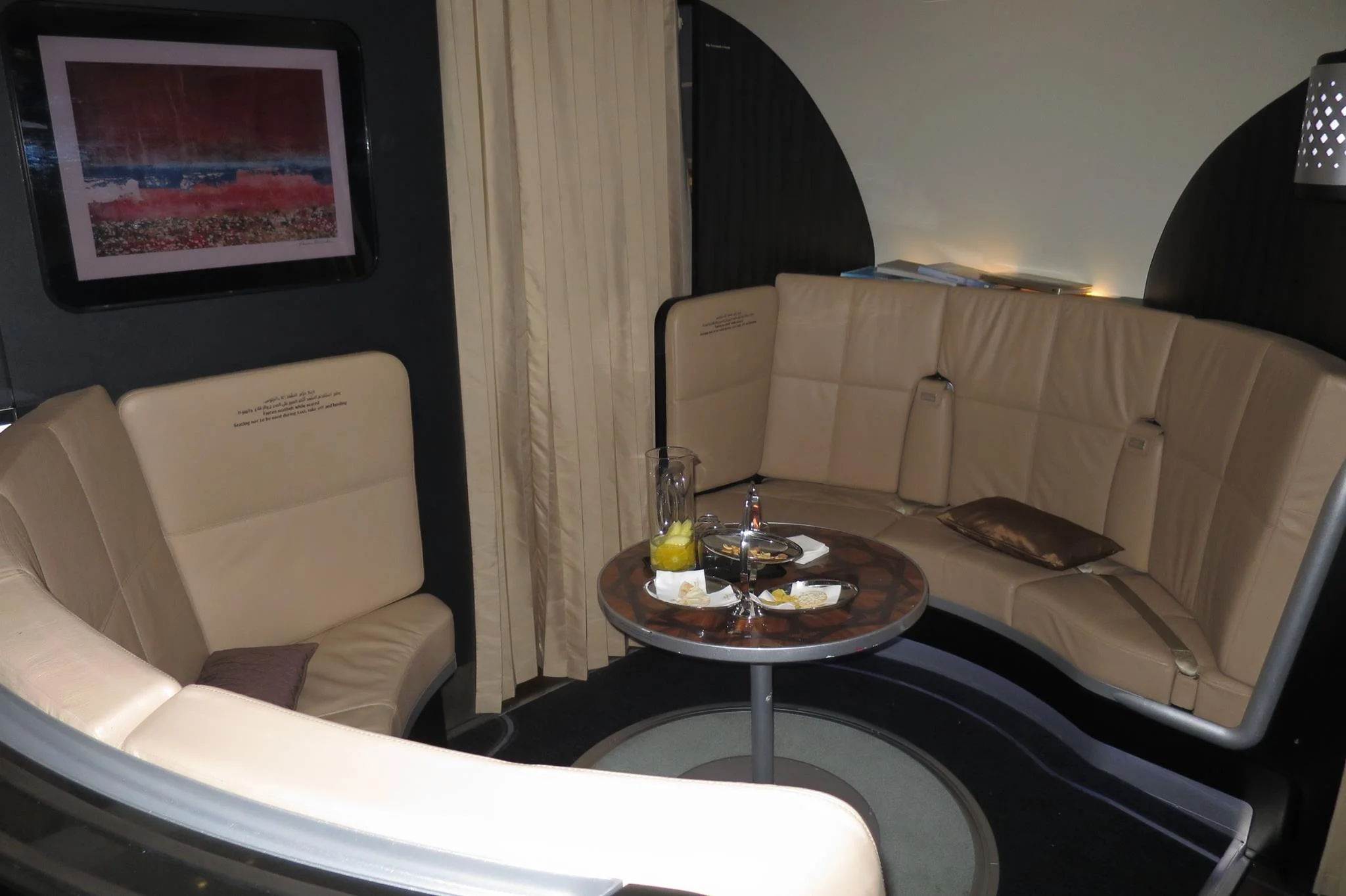 Between first class and business class is a nice little lounge area
