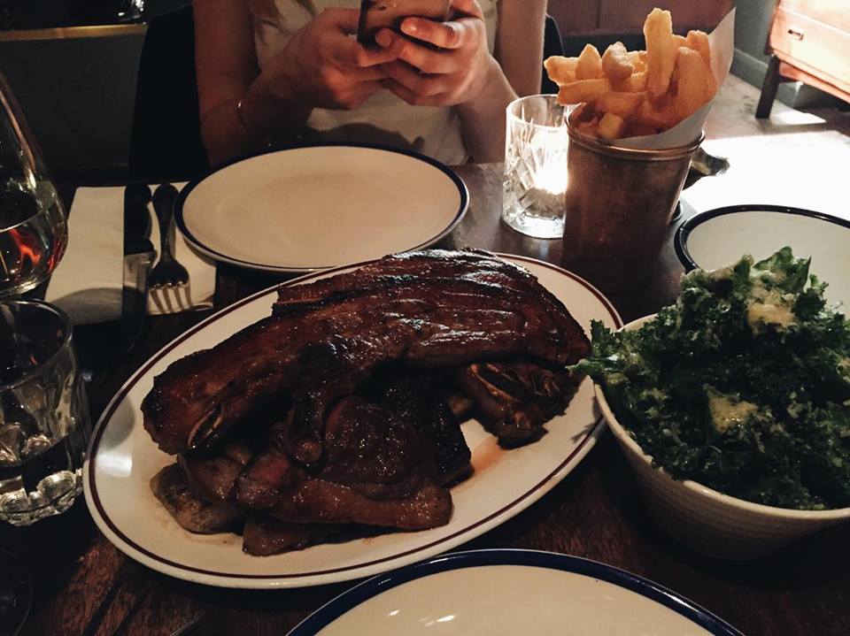 "All In" £20 per head | Parmesan kale, beef dripping chips, pork chop, lamb chop, and rare steak on top of a rosemary, meat-soaked flatbread.