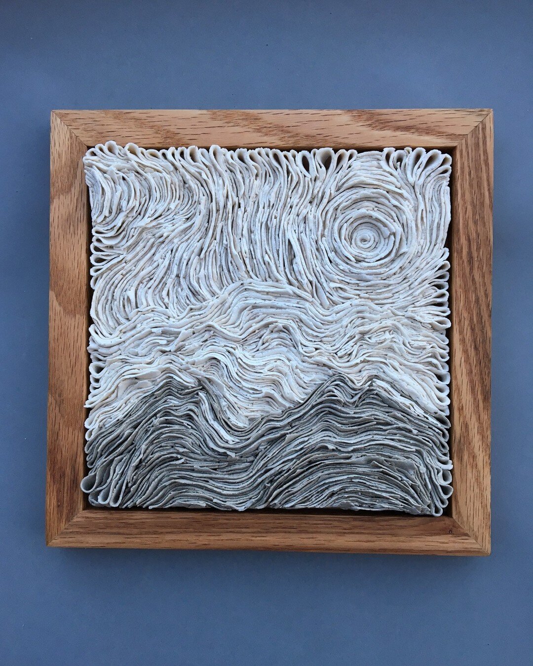 Good news! If you've found yourself ogling this tile depicting abstract mountain ridge lines, hand built in blended porcelains and custom framed in oak, you are in luck!

This baby is currently available for auction online via Alaska Pacific Universi