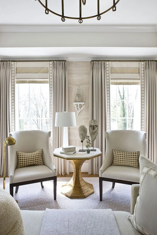 Living-Room-Draperies-and-Roman-Shades.-Living-room-with-horizontal-stripe-roman-shade-roman-shade-mounted-at-height-of-rod.-LivingRoom-Draperies-RomanShades-WindowTreatment-Via-Michael-Hampton-Design.-.jpg