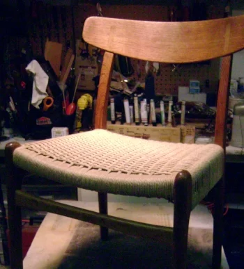 Danish chord first gained popularity in the mid-century modern furniture movement and was largely used on pieces of Scandinavian decent. It is a durable paper chord material and has been used for many decades. It can be woven in many different styles and patterns. Seen here is the "basket weave" done by one of our weavers. 