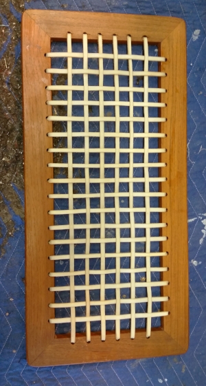Raw Hide is a very versatile, durable and widely used material that has been used since ancient times. It can be used on seats, benches, backs, canoe seats, snow shoes, or as a decorative accent on a piece such as this shelf (above) from a 1960's side table. 