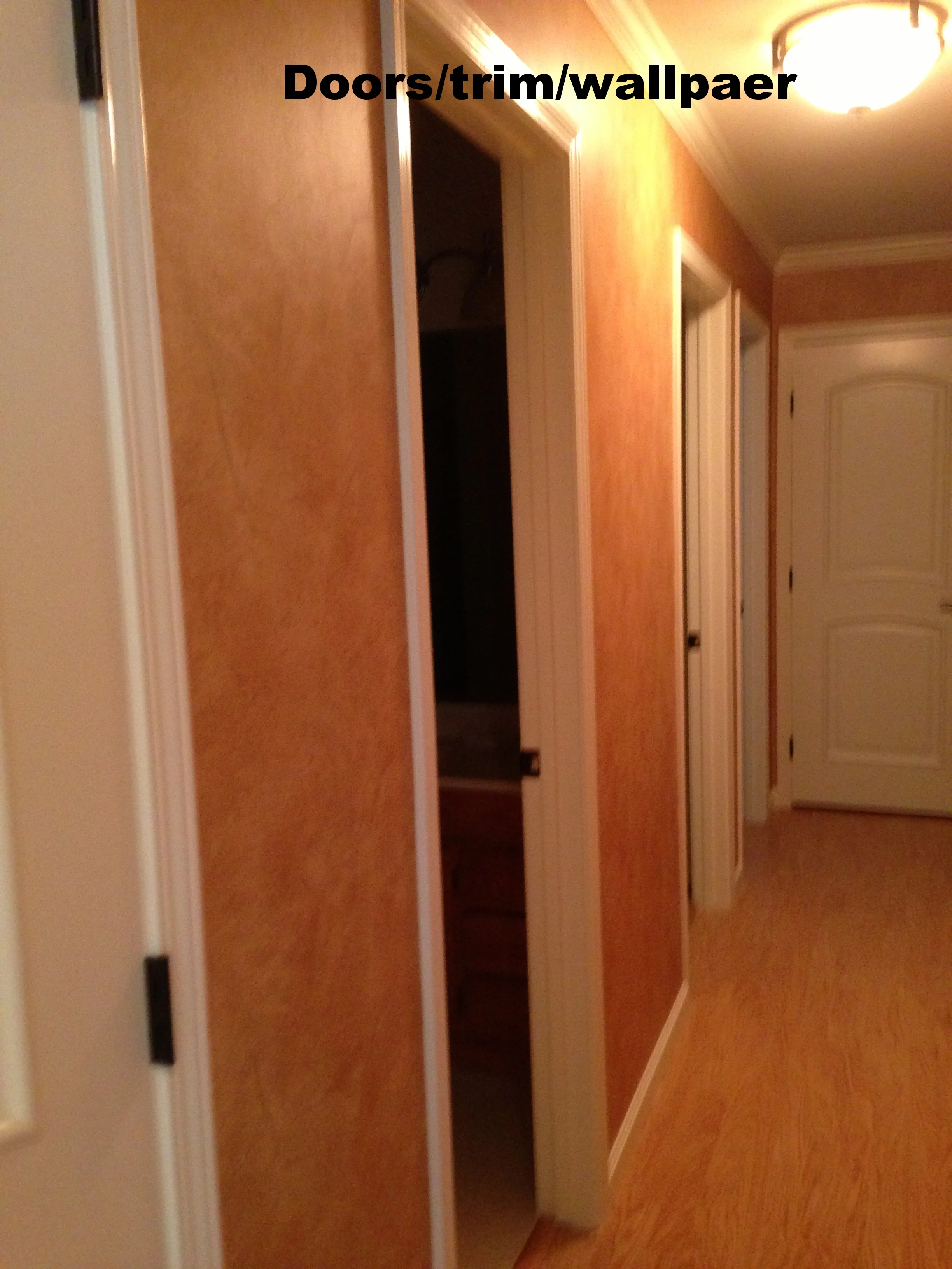 Interior doors, moldings and wallpaper.