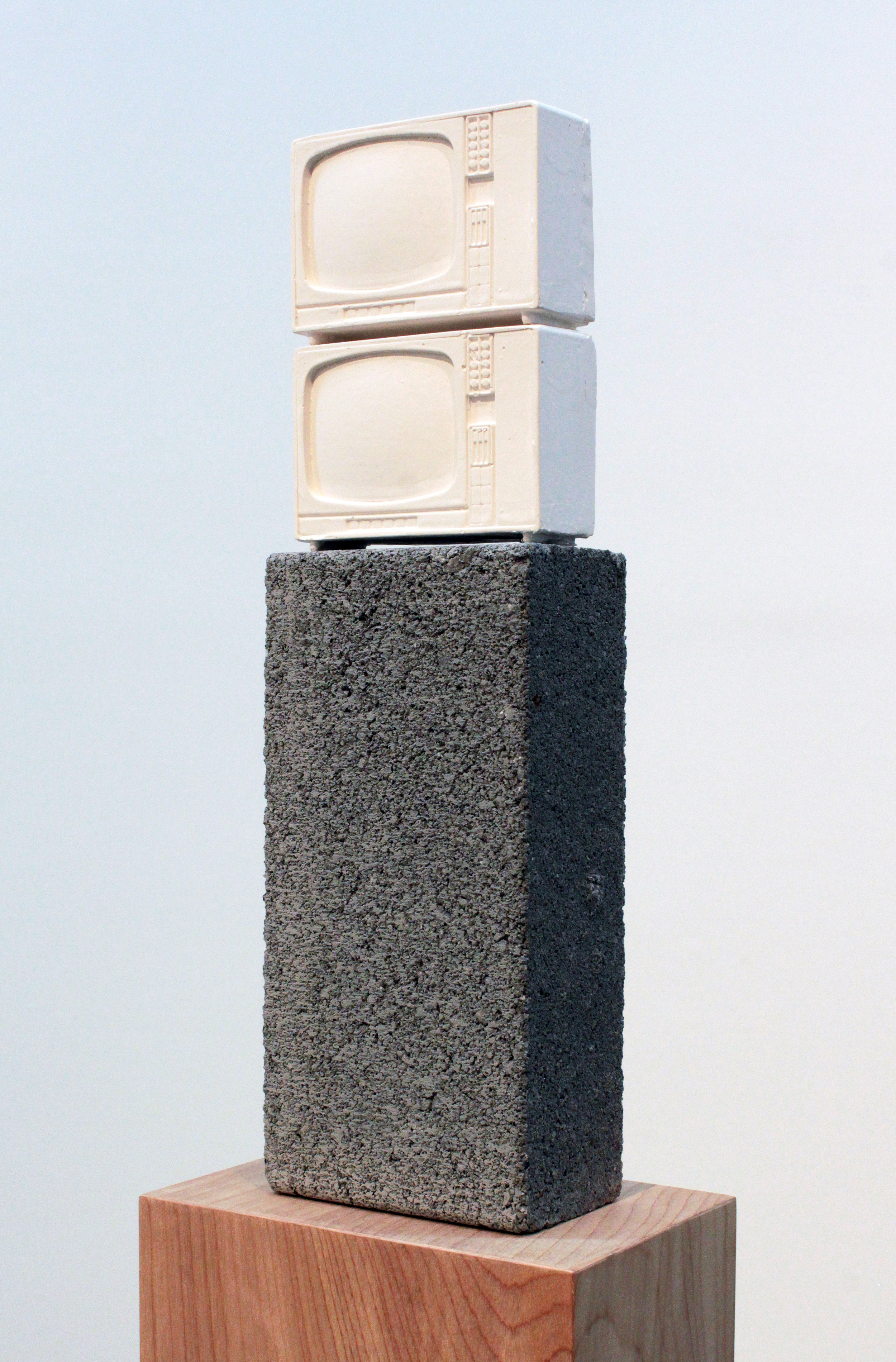   Esperanza Mayobre © 2010  ,   Monumento a la TV (y a Brancusi)  . Hydrocal, wood, concrete block. 50 x 7 x 5 in. Courtesy of the artist.   