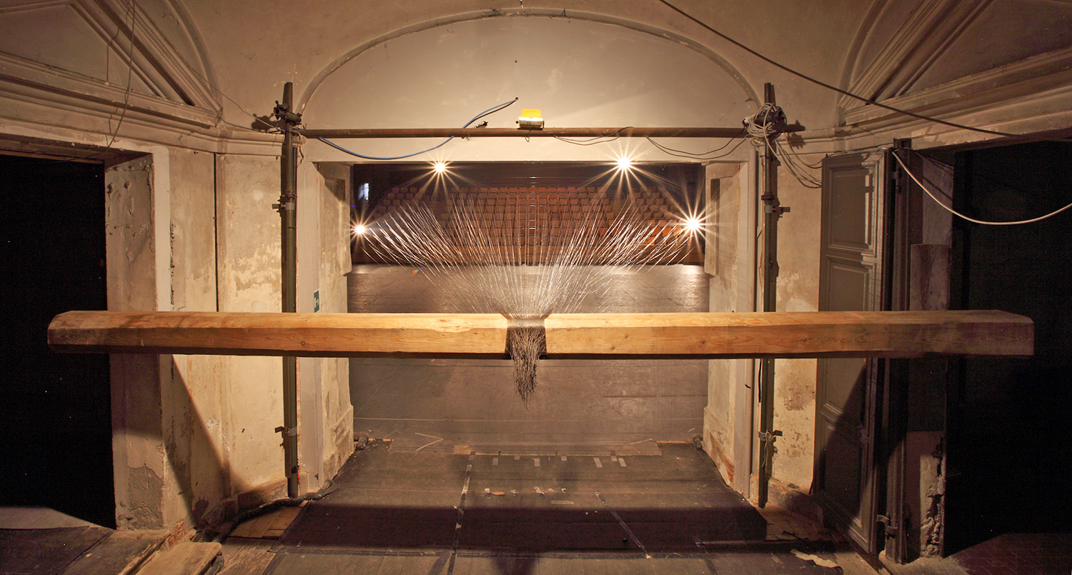   Santiago Reyes Villaveces  ©  2014 ,  Traino (Towline) . &nbsp;Steel wire, wood beam and chairs. 164 x 114 feet (50 x 30 m). Courtesy of the artist. Photo: Paolo Pellion 