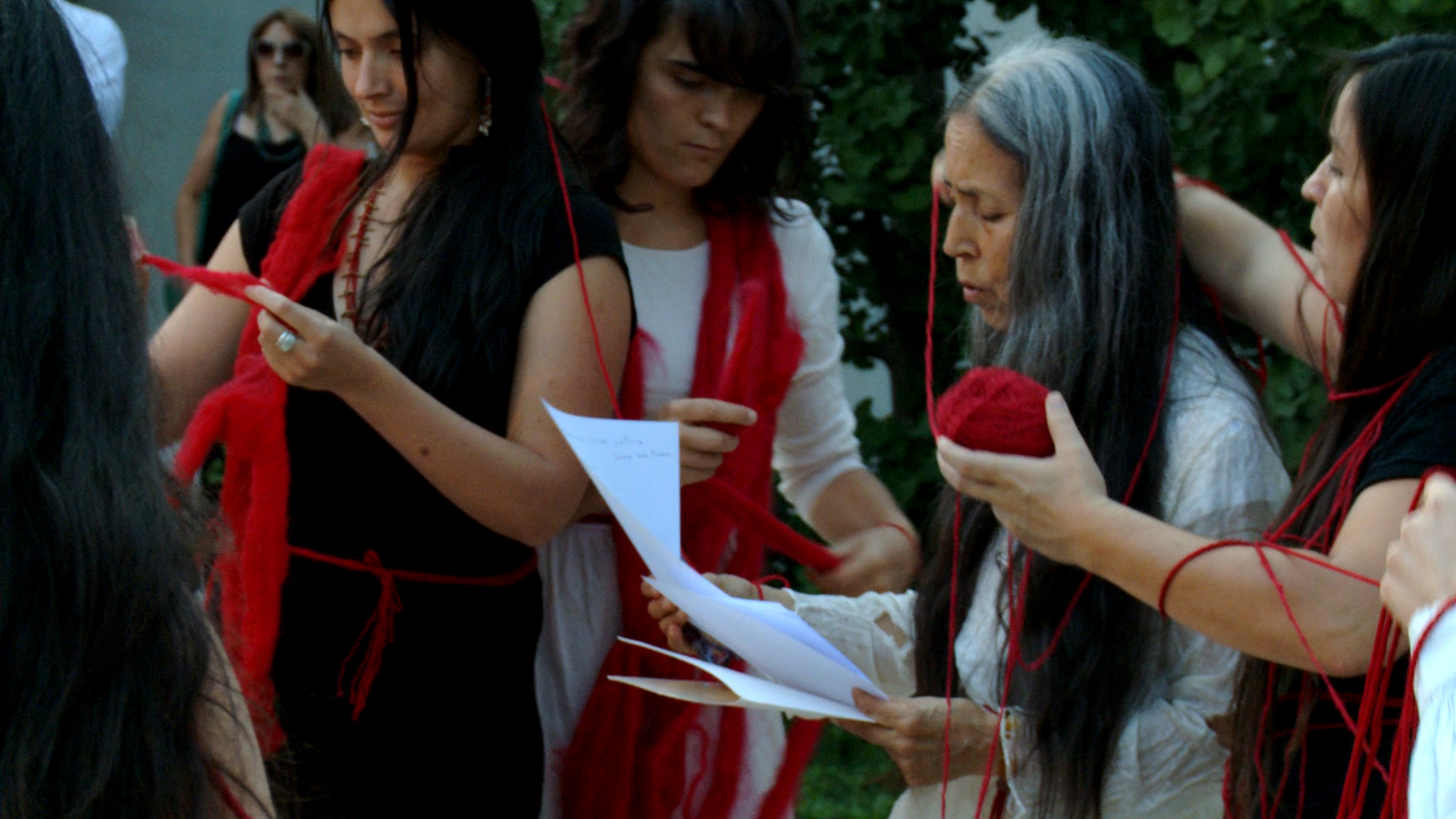   Cecilia Vicuña © 2015 ,  Cantos del Agua.  Performance at Patricia Ready Gallery, Santiago, Chile. Courtesy of the artist. 