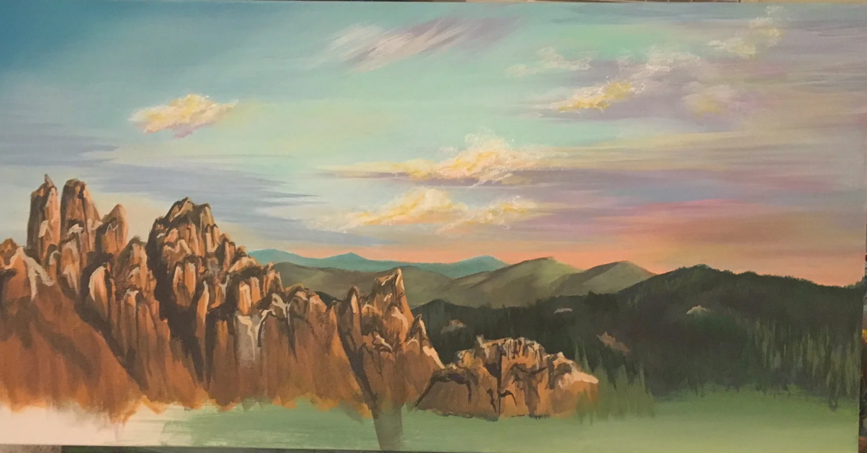 so rocks are hard but i love the sunset meeting the far back mountains