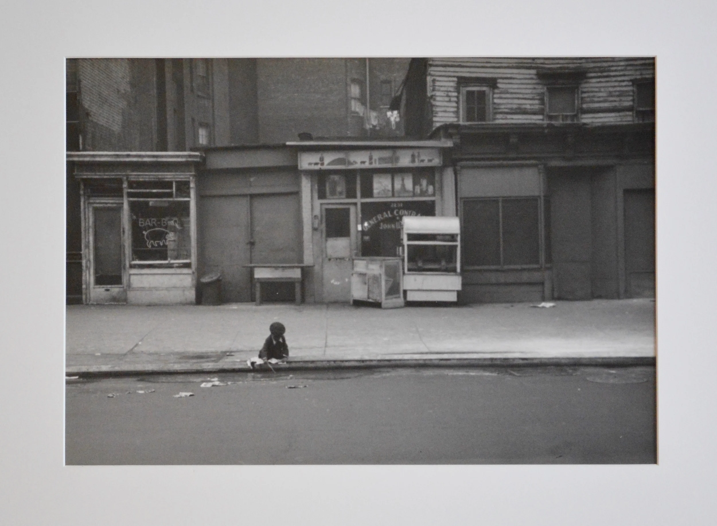 Roy DeCarava, Child Playing at Curb, Eighth Avenue, 1952, 14 1_8 x 19 7_8 in