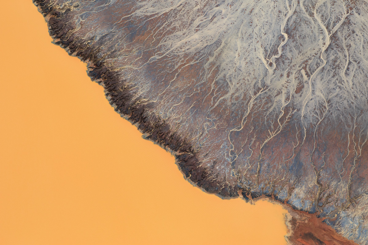Oh Minas Gerais - New number 10 Aerial Photograph, Feb 2016. Wet season in Brazil. The sediments and water interacting at a tailing dam. Photograph taken at Quadrilatero Ferrifero, region that used to be on of the largest iron ore reservoirs in the world. Almost all the top quality iron is gone now, leaving the low quality iron for exploration that requires even more digging and lans