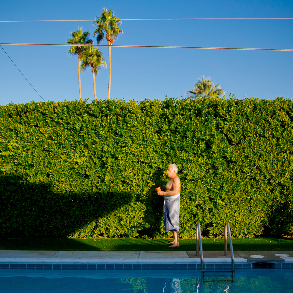 Poolside Cigar A sun worshipper smokes a cigar while bathing in the warm afternoon sun after a dip in the pool. ©Image and caption courtesy of Nancy Baron