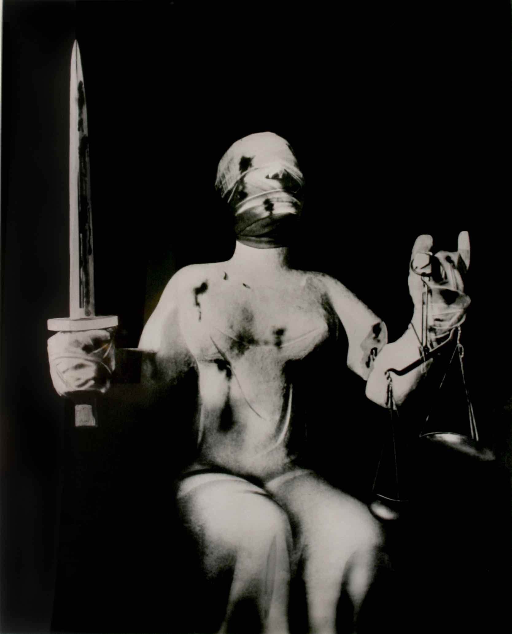 John Heartfield (1891-1968) Der Henker und Die Gerechtigkeit (“The Executioner and Justine”), c. 1933 gelatin silver print 37 x 29 1⁄2 inches courtesy Ubu Gallery, New York.