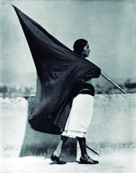 Woman with Flag, Photograph by: Tina Modotti