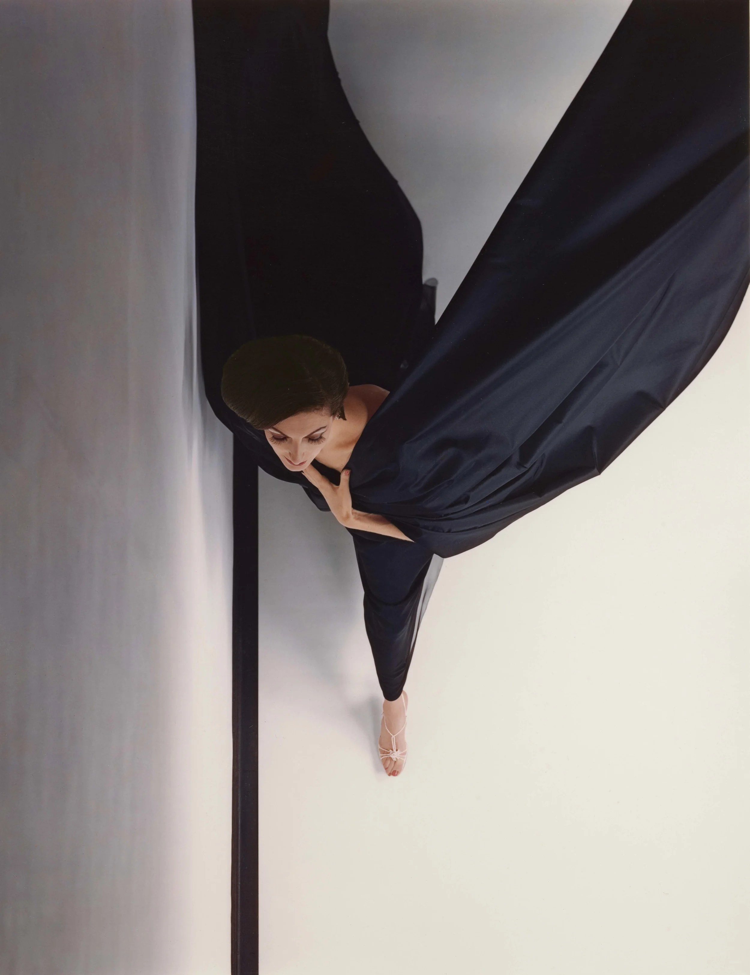HIRO (American, born China, 1930), Black Evening Dress in Flight, New York , negative, 1963; print, 1994. Dye imbibition print 48.9 × 38.1 cm (191⁄4 × 15 in.) Los Angeles, J. Paul Getty Museum, Purchased with funds provided by the Photographs Council, 2012.24.2. © Hiro