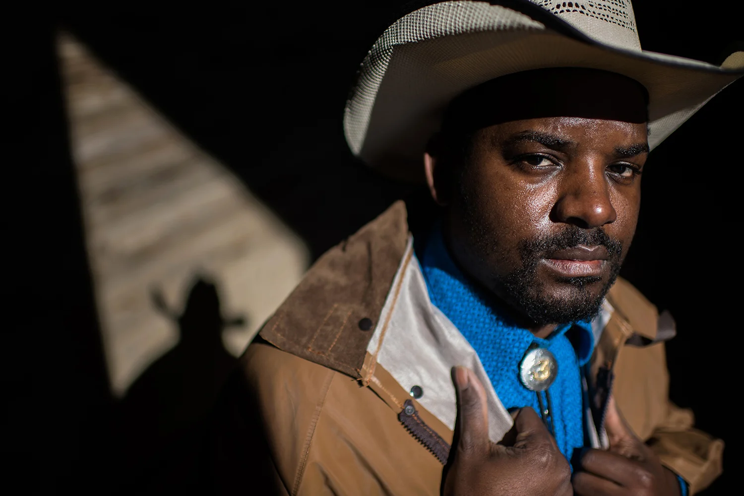 A cowboy named Jessie poses for a portrait in Bolivar County, Mississippi. Photo by Rory Doyle.