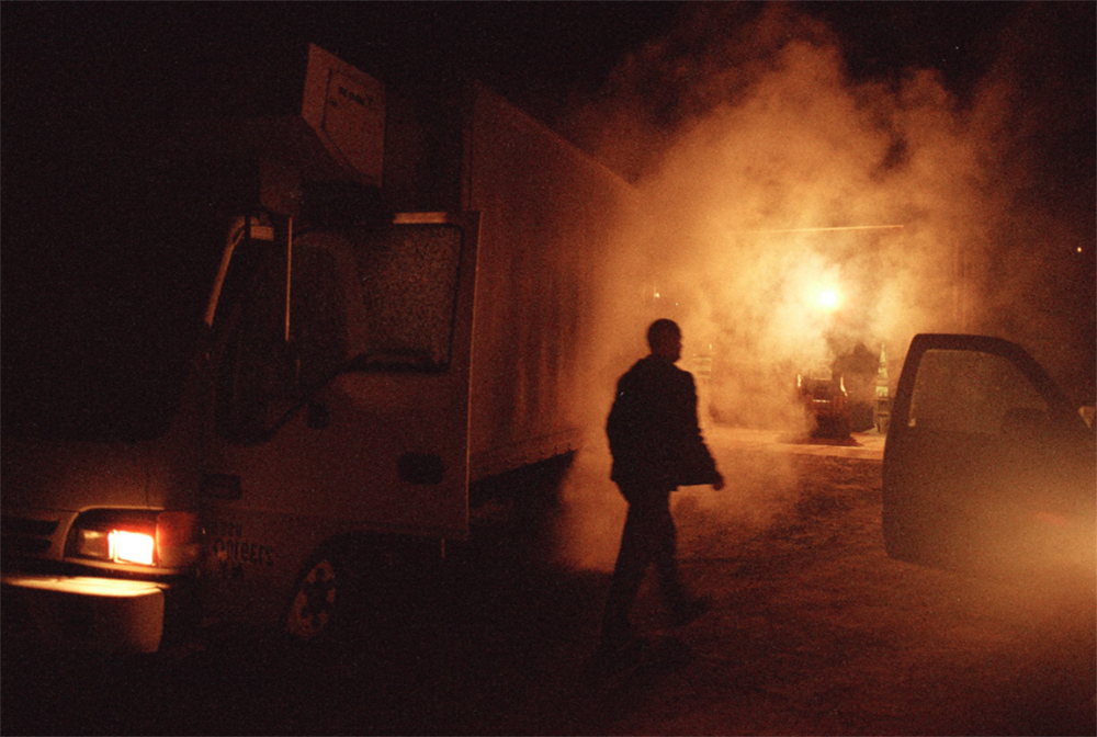 "Jason at 5am." In 2000 Holley White and Richard Giles moved from Texas to Hamden, NY to start Lucky Dog Farm. Here, Jason is loading the truck with organic produce to sell at the Union Square Greenmarket. © Tess Mayer