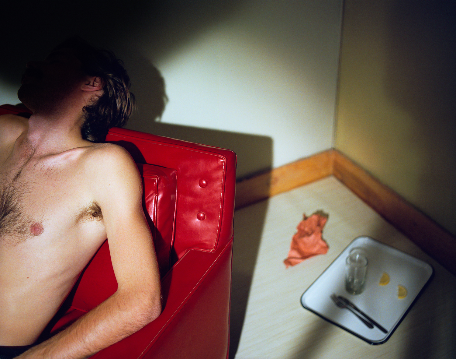 Now and Then © Jo Ann CallisMan in Red Chair, 1979, Archival Pigment Print, 24 x 30 inches