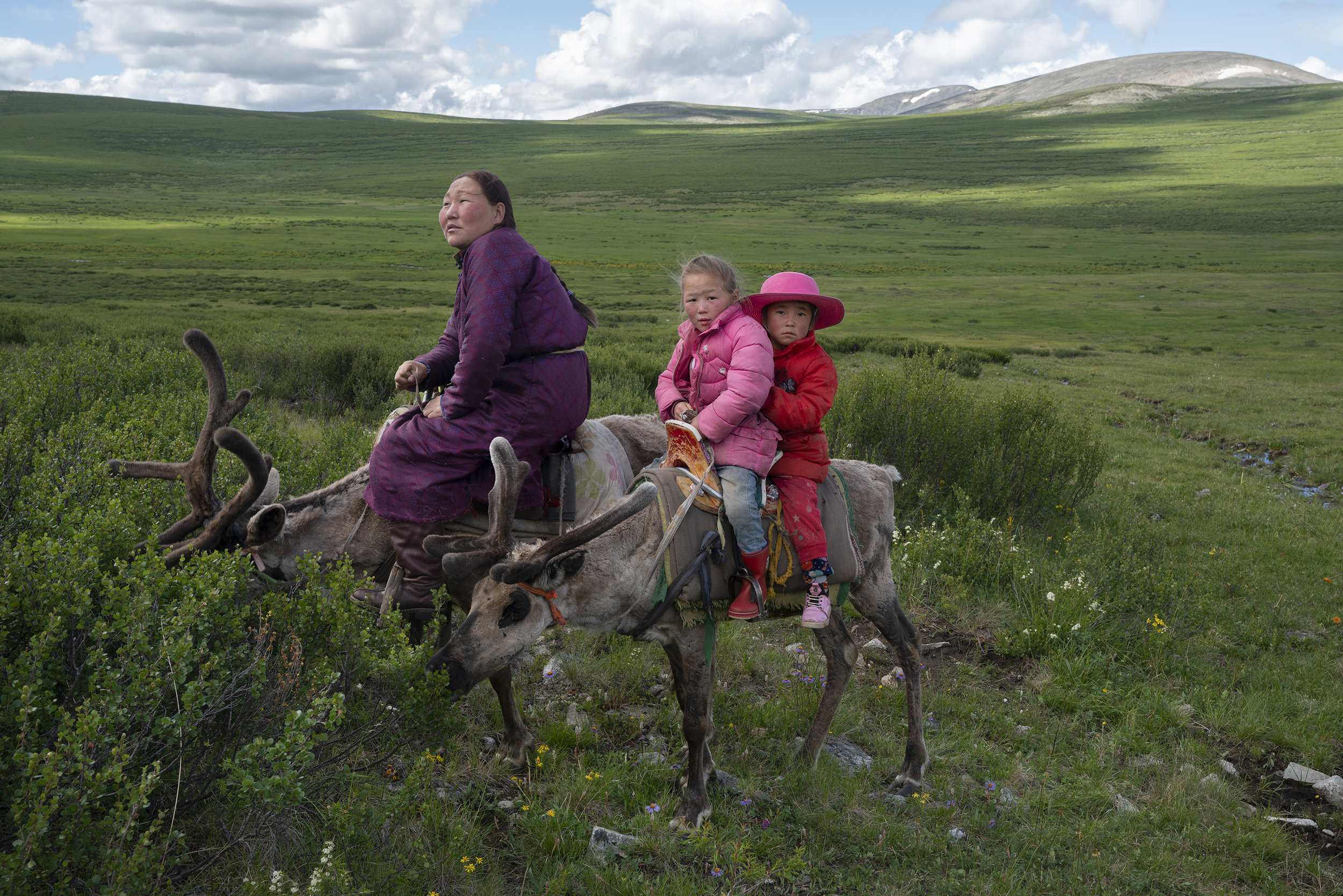 We came accross this little convoy in the middle of nowhere. It turns out they were trekking 4 hours to another camp. It was the first time I saw the Tsaaten riding the reindeer. It took my breath away, but eventually became the most natural thing in the world. © Meghan Boody