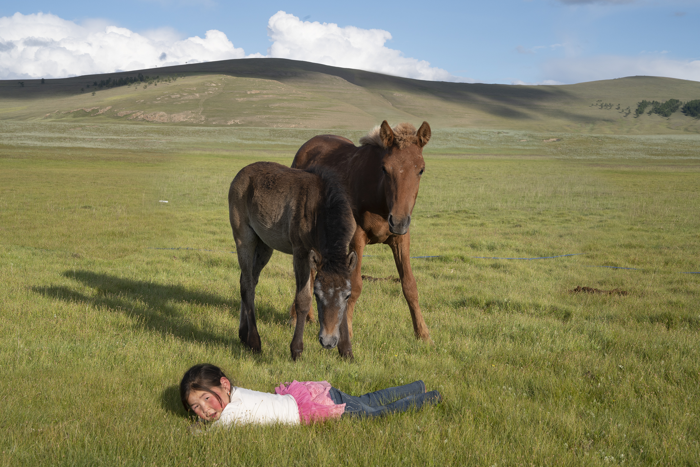 Otgon the daughter of Lhagva, my horse driver. After our first 6 day trek together, he invited me and my guide to spend the night in his small log cabin. © Meghan Boody