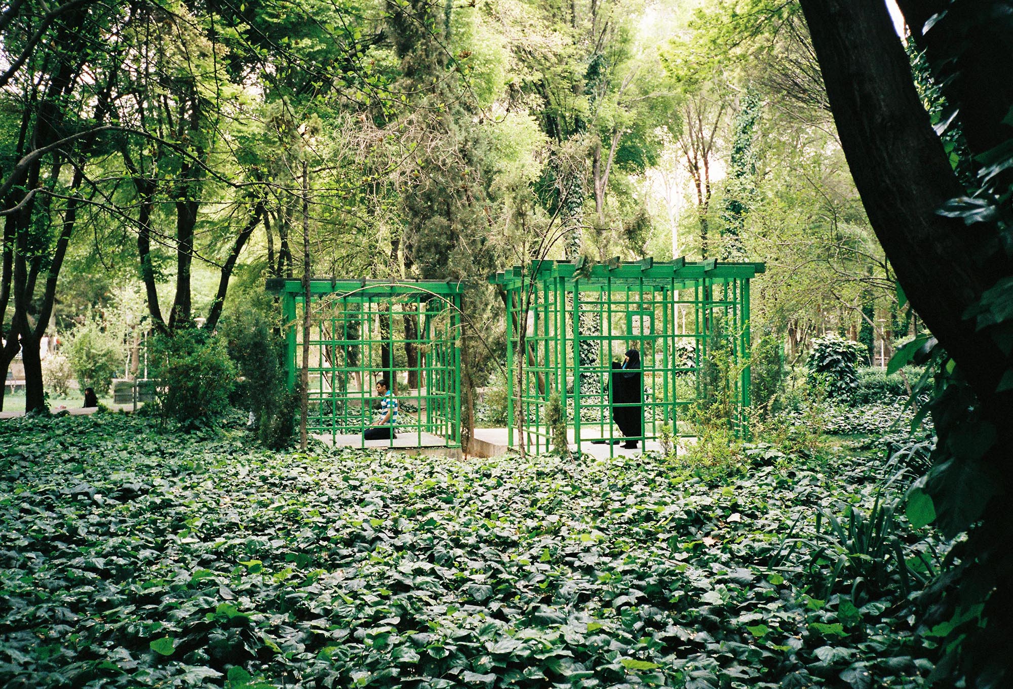 Muslims praying in cage structures in a public garden. Isfahan, Iran, 2017 © Laure d’Utruy