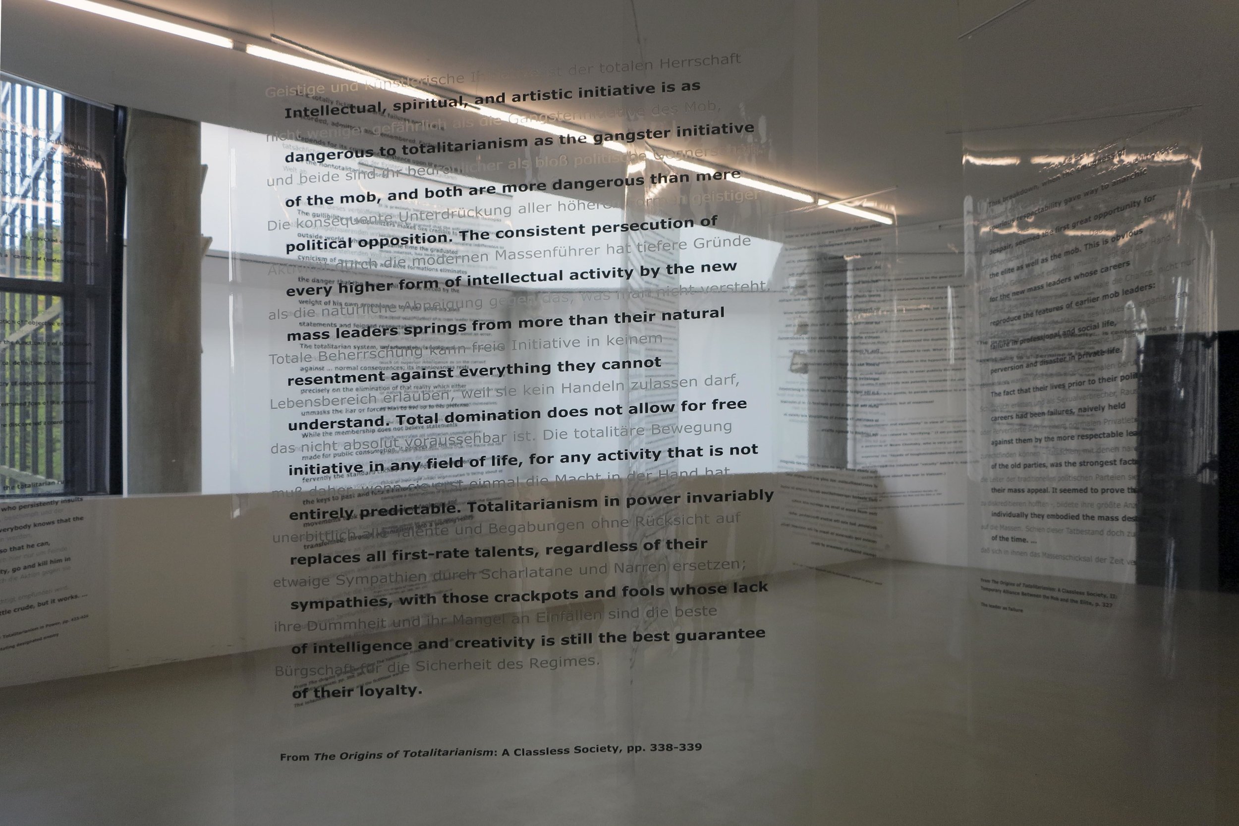 Martha Rosler, detail of Reading Hannah Arendt (Politically, for an Artist in the 21st Century), 2006, installation with excerpts from Hannah Arendt’s writings, in English and German, on transparent vinyl panels. Artwork © Martha Rosler