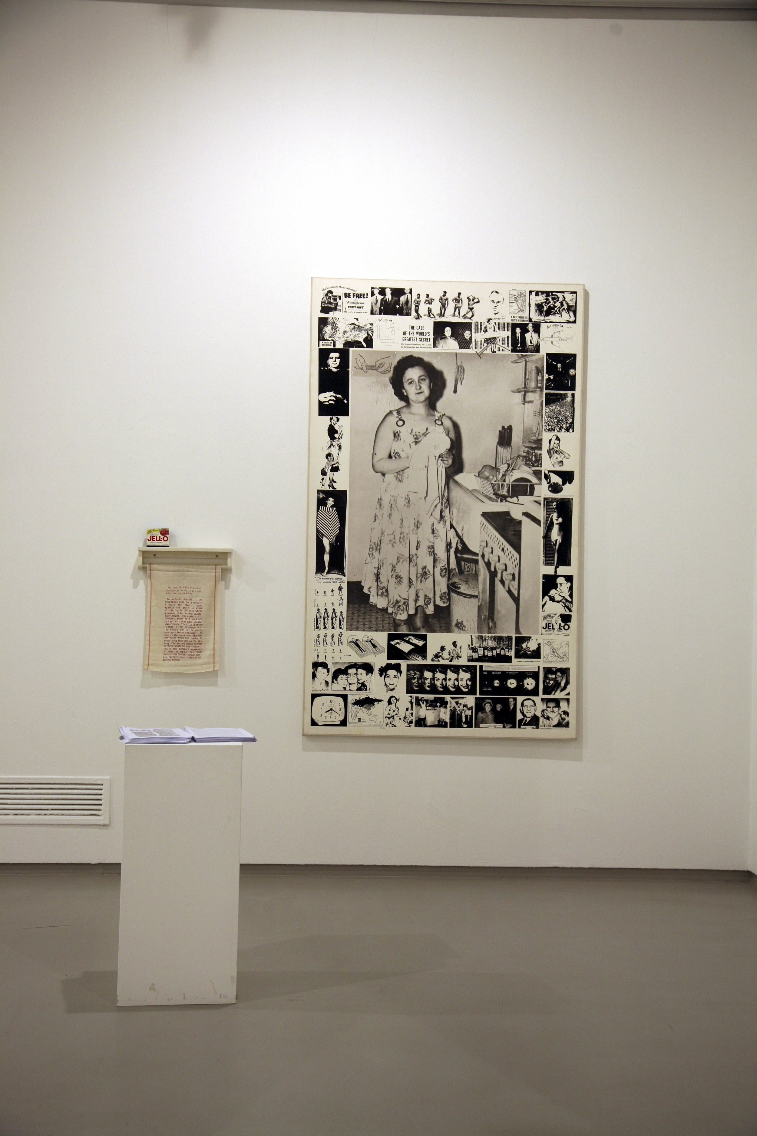 Martha Rosler, Unknown Secrets (The Secret of the Rosenbergs), 1988, installation with screenprinted black-and-white photographs on canvas, wooden towel rack with stenciled towel and Jell-O box, and printed text handout. Artwork © Martha Rosler