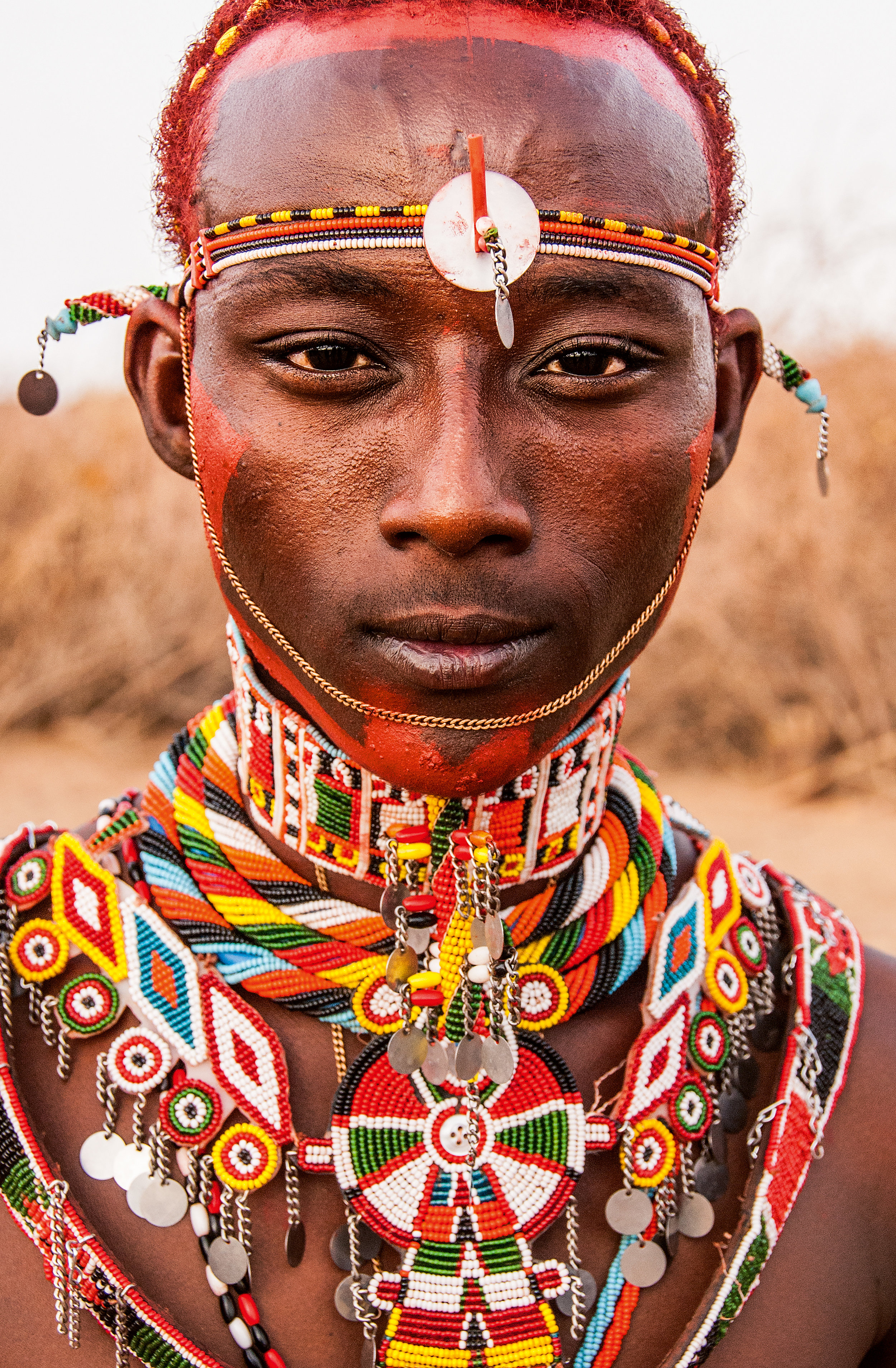 Portrait of a young warrior at the close of the Herr Heroon ceremony. © African Twilight: The Vanishing Cultures and Ceremonies of the African Continent by Carol Beckwith and Angela Fisher, Rizzoli, 2018.